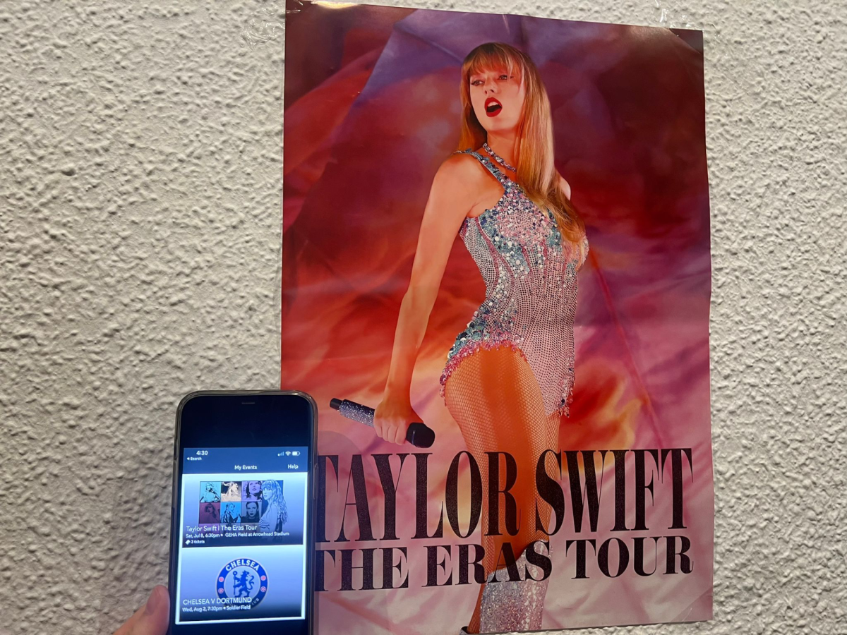 A Taylor Swift fan at SLU Madrid has the poster and a ticket from an Eras Tour concert in July. 