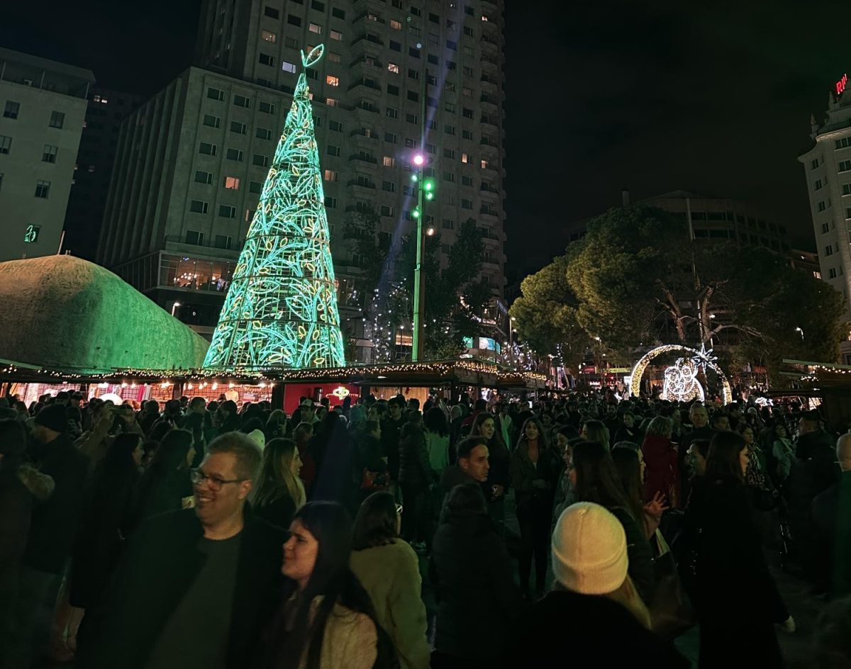 Crowds pack the Christmas market at in Plaza de España on a recent evening.
