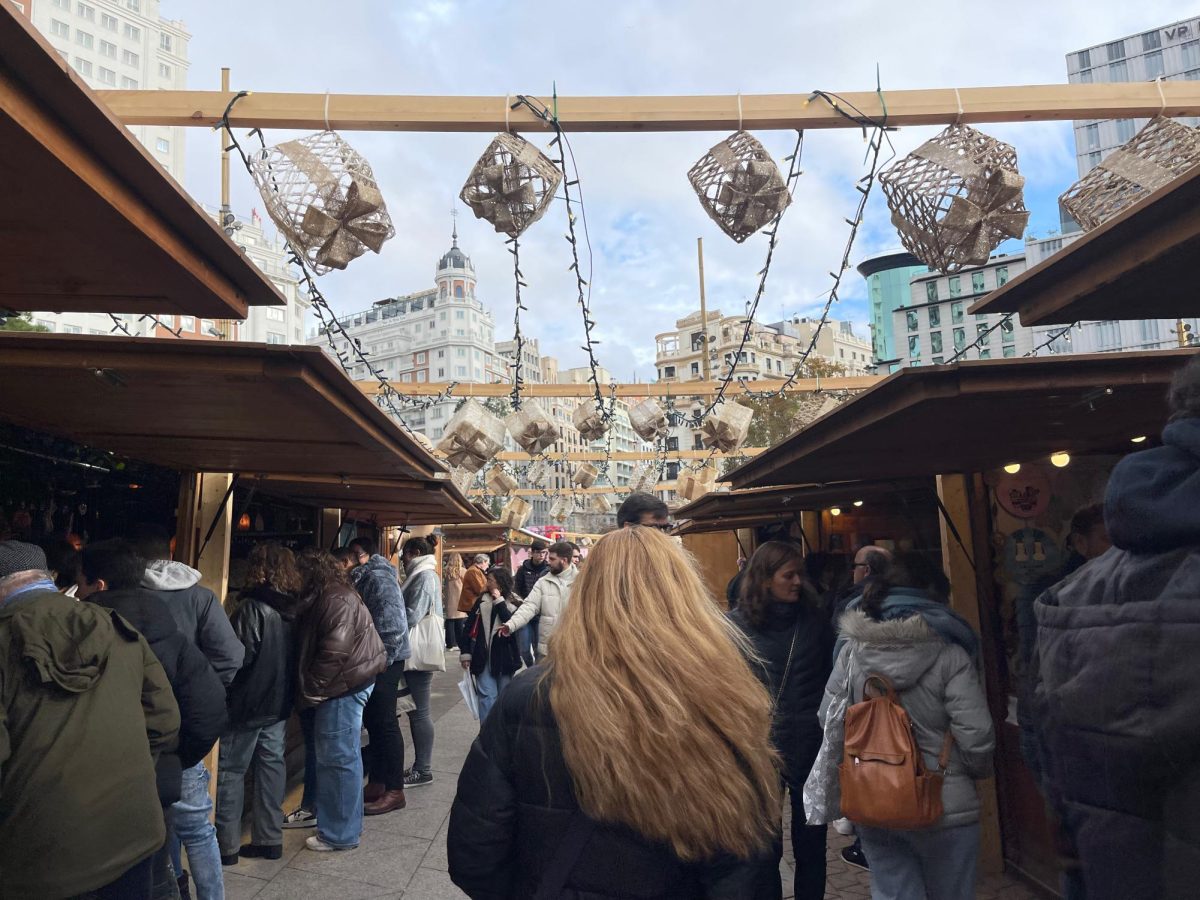 Shoppers browse the Christmas market at Plaza de España on a recent weekend.
