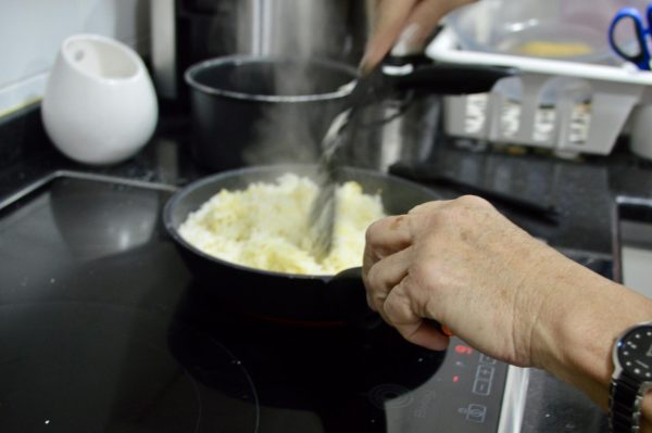 Host mom María Jesús Casto cooks for her host family.