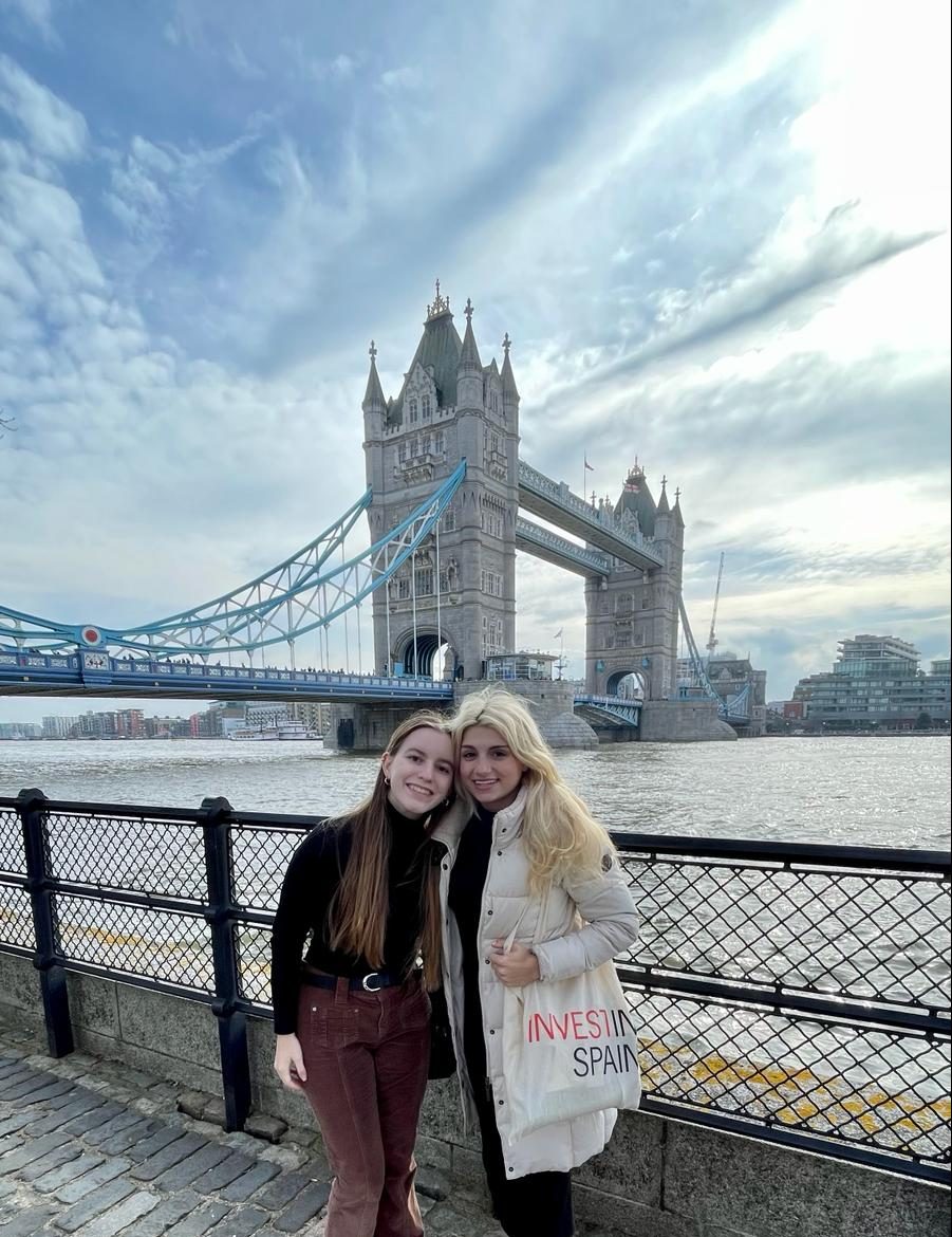 The writers, Lilla Orban (left) and Ashlan Wilburn (right), pose before a view of the London Bridge.