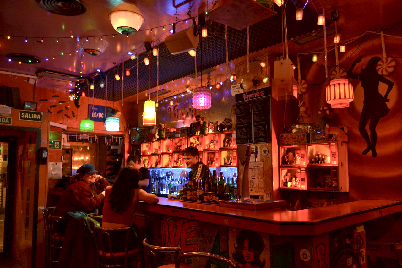 A quiet moment at Tupperware Club, or Tupper, in Malasaña known for its electric decoration. 