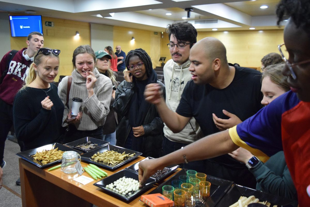 Students sample yogurt-covered crickets at a bug tasting event this fall organized by the Gourmet Club.