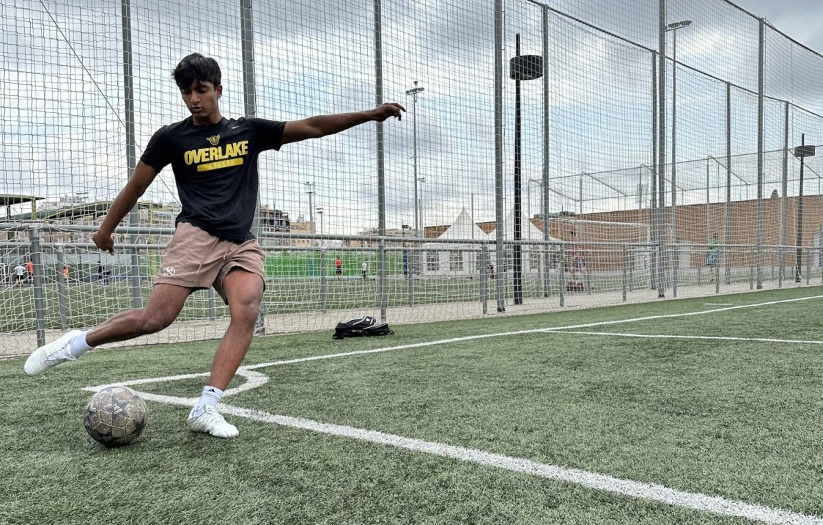 Armaan Thomas, a soccer team player, warming up before practice.