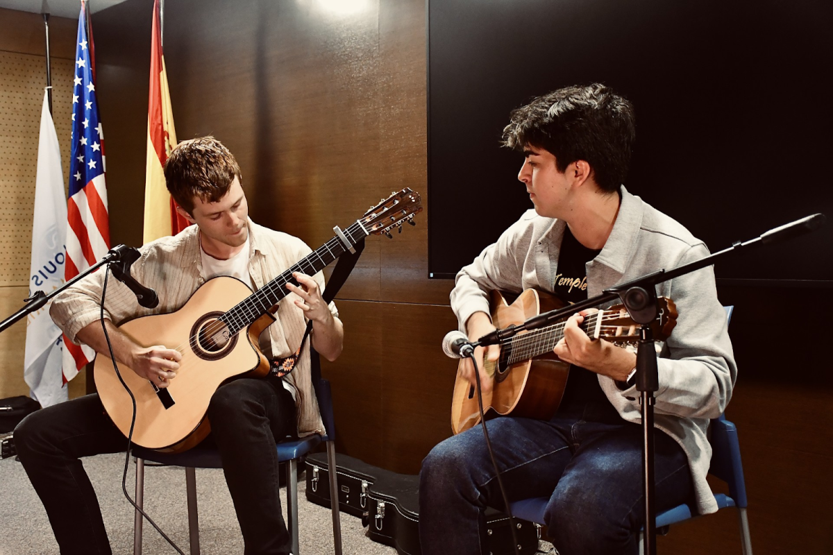 Freshmen Kyle Sidwell (left) and Benjamin Augusto Saravi tune their guitars before performing
a flamenco-flavored number.