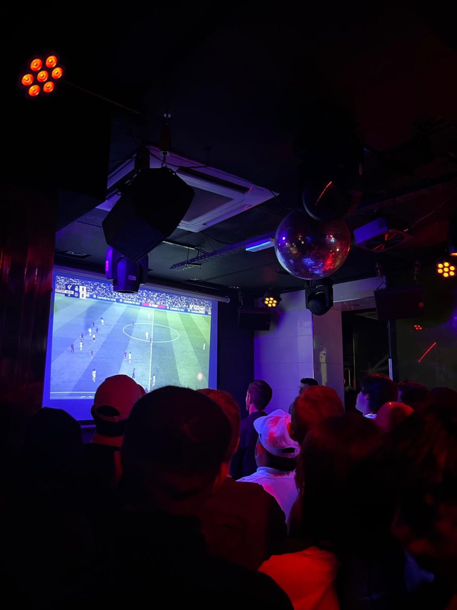 Fans watch El Clásico, the match between rivals Real Madrid and Barcelona, on Oct. 26 at Commo Bar.