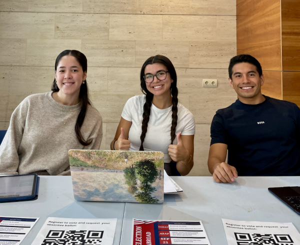 Members of the Student Government Association running a table to help students register to vote.