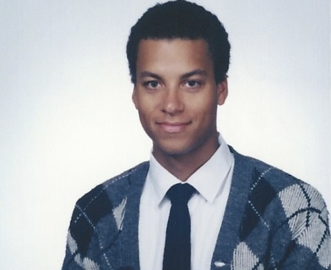 Jawara Sanford at the age of 24. His parents forced him to pose for this photo in 1996. He sports his father's sweater.