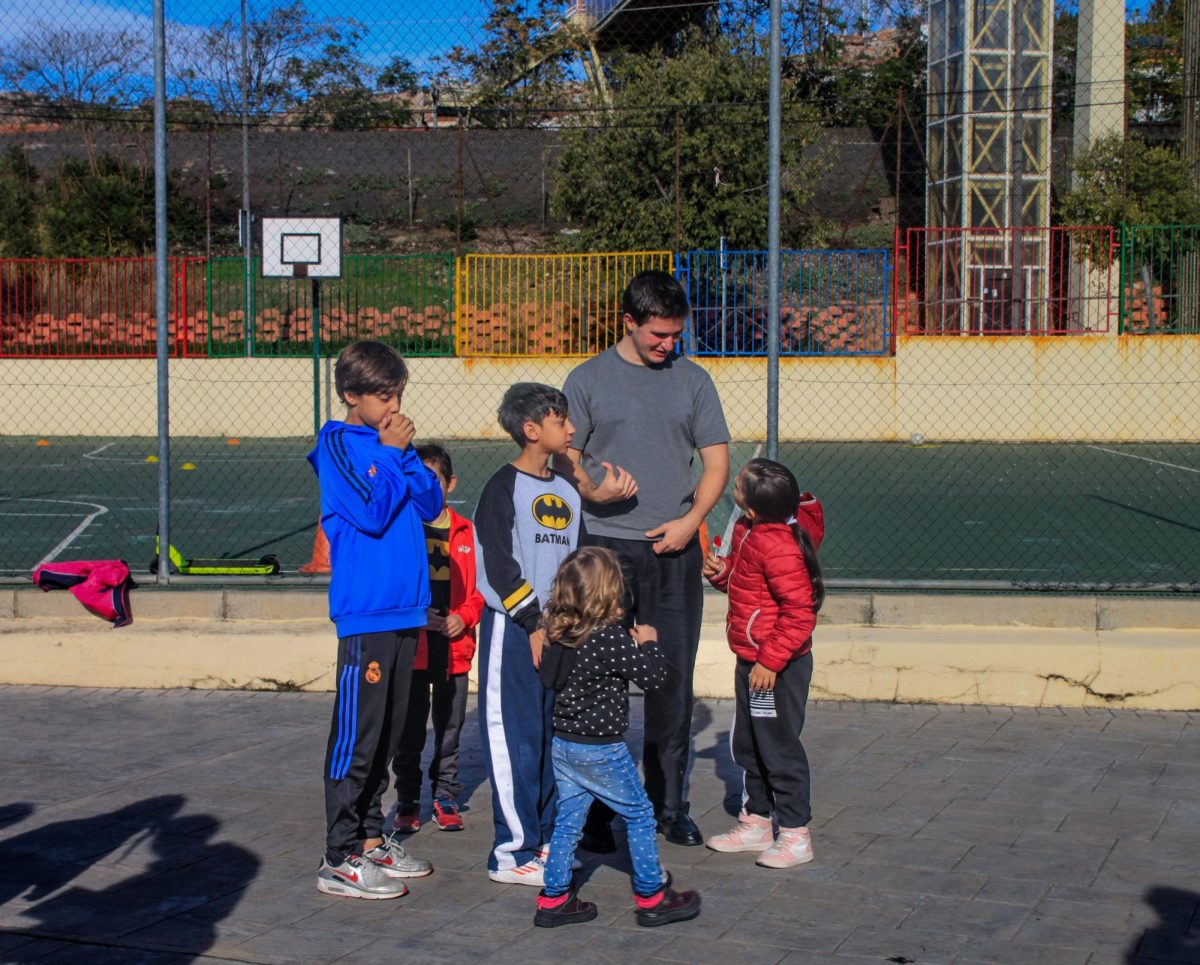 Senior Alex Martinez talks to his workshop group before playing soccer.