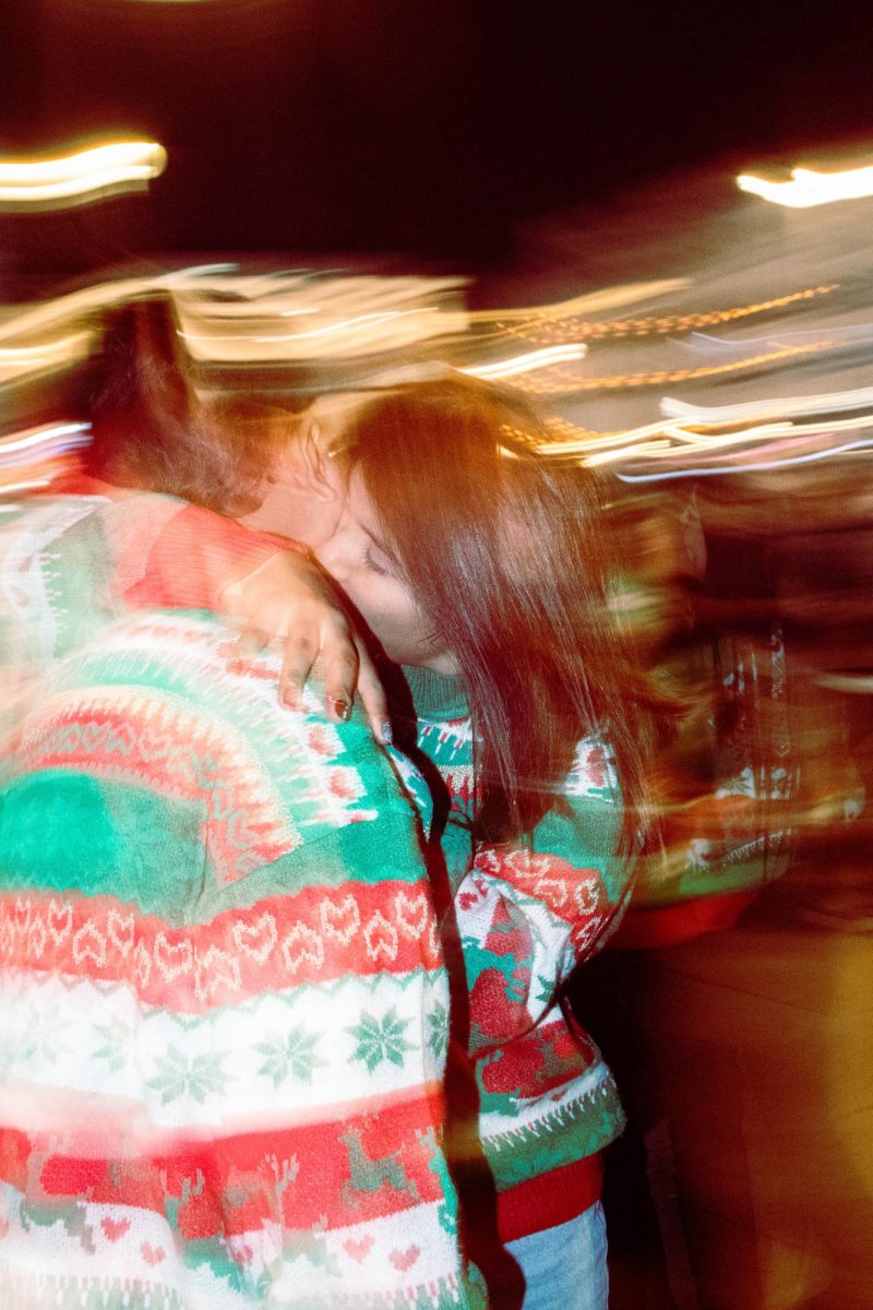 A couple lost in their intimacy in the heart of Puerta del Sol in front of the Christmas tree lighting on Dec 2. 