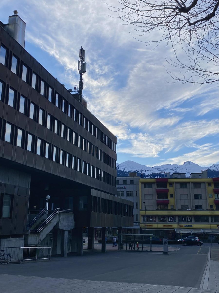 Vaduz's industrial-style city contrasted against the snowy Alps.