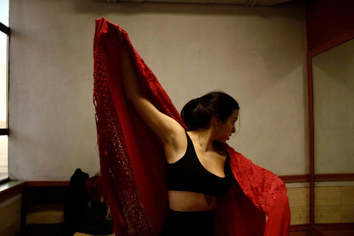 The mantón de Manila, a richly embroidered shawl, is an essential part of flamenco. More than an accessory, it extends the dancer’s movement, adding weight, fluidity, and drama. Mia once struggled with its weight, but now, it moves with her like a second skin. In Mia’s hands, it becomes an extension of her emotions. 