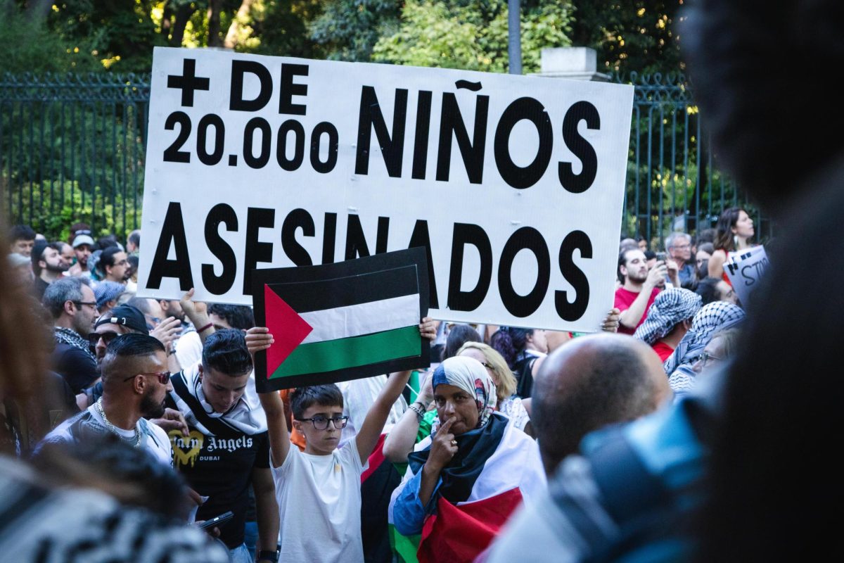 A young boy participates in the chanting crowd of pro-Palestinian protestors.