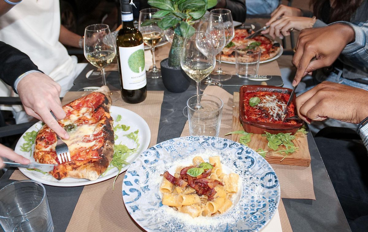 Diners at Troppo Napoletano taste the calzone al forno ripieno, filled with tomato sauce, fior di latte, ricotta and Parmigiano; the pasta carbonara, made with egg yolk, guanciale, and Parmigiano; lasagna napoletana, layered with ragù, meat, ricotta, Parmigiano and mozzarella; and their classic pizza margherita, topped with tomato and mozzarella.