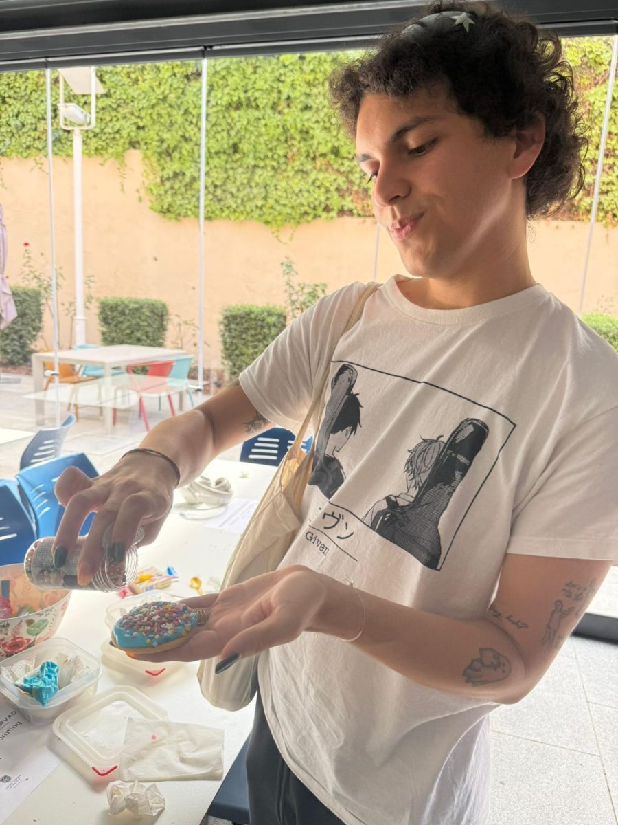 Ernesto Lange decorates a cookie to support friends at the Pride event in September.