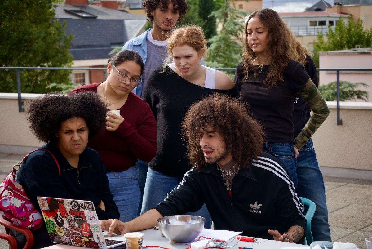 Students gather around Cryymm as he discusses his project on the SIH rooftop on Oct. 24, two days before his concert. 