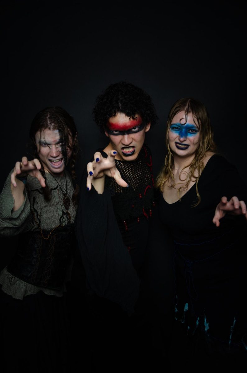 Students get into character to film the appearance of the witches prior to the performance.