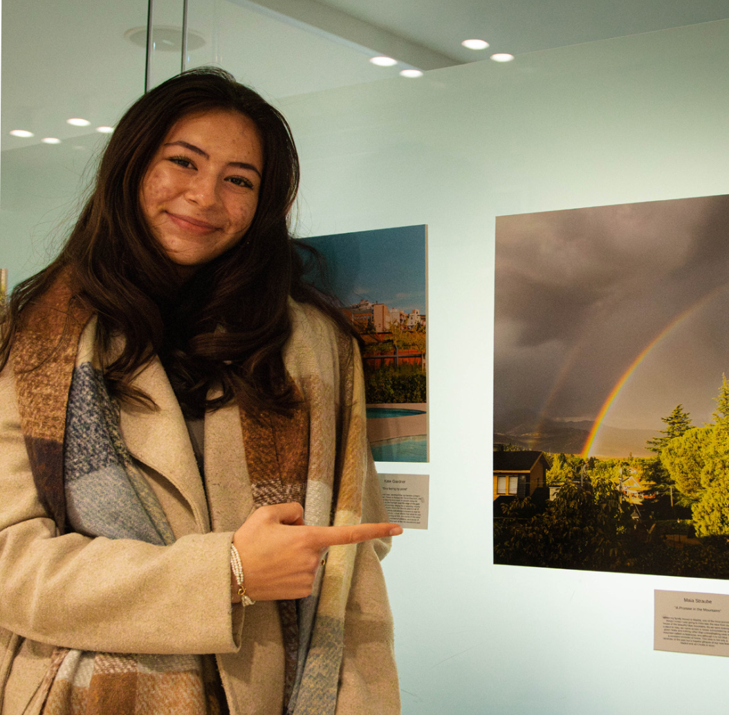 A student shows her work at the photo exhibit, Memorias Madrileñas. Thirty photos were chosen for display out of 150 submissions.