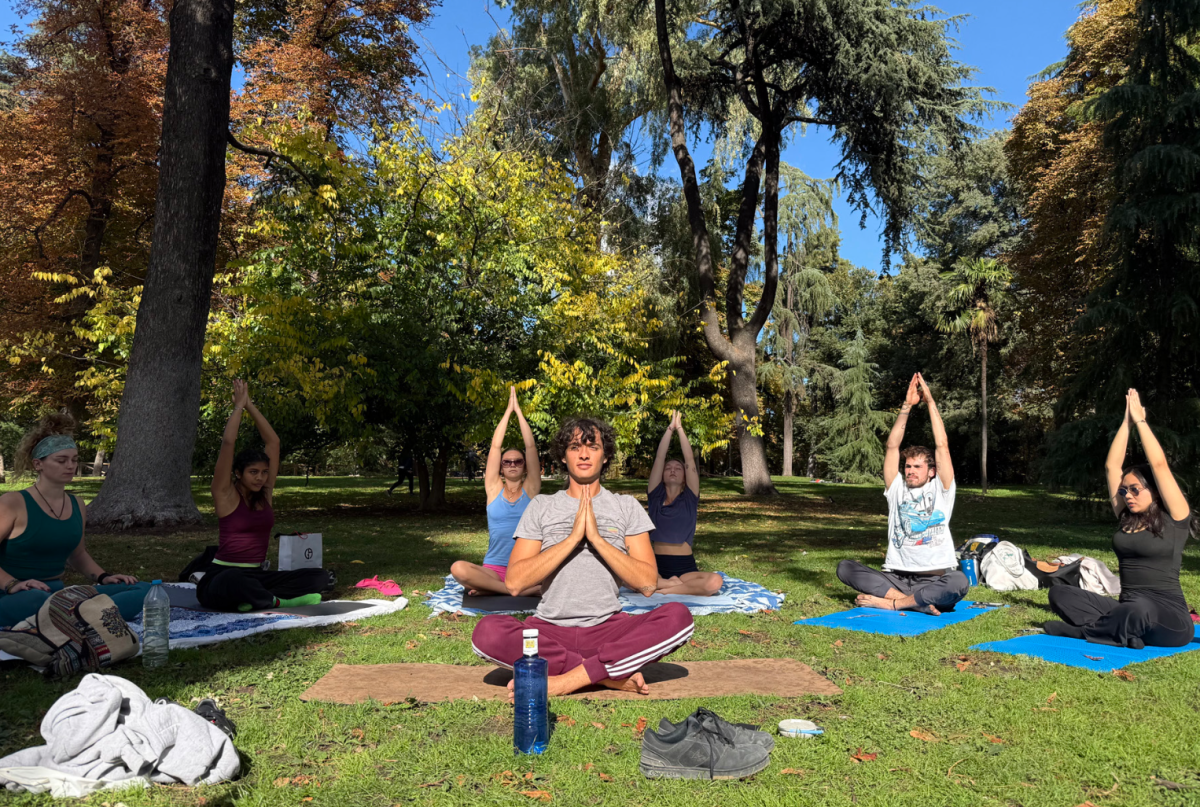 Yoga instructor Andrew Chitel leads the yoga session in the Retiro Park on Sunday, Oct. 26.